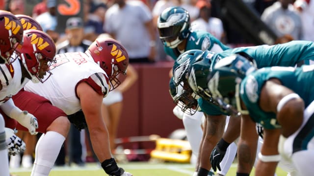 The Washington Commanders offense lines up against the Philadelphia Eagles defense during the first quarter at FedExField. Mandatory Credit: Geoff Burke-USA TODAY Sports